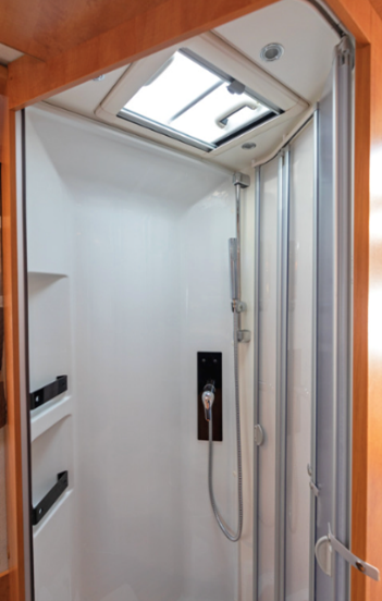 Interior of a camper featuring a clear skylight.